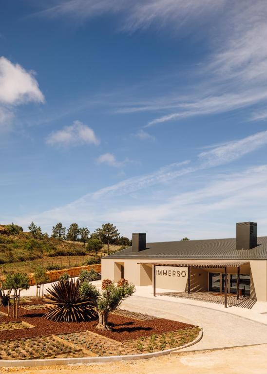 a building with a sign that reads mavericks at Immerso Hotel, a Member of Design Hotels in Ericeira