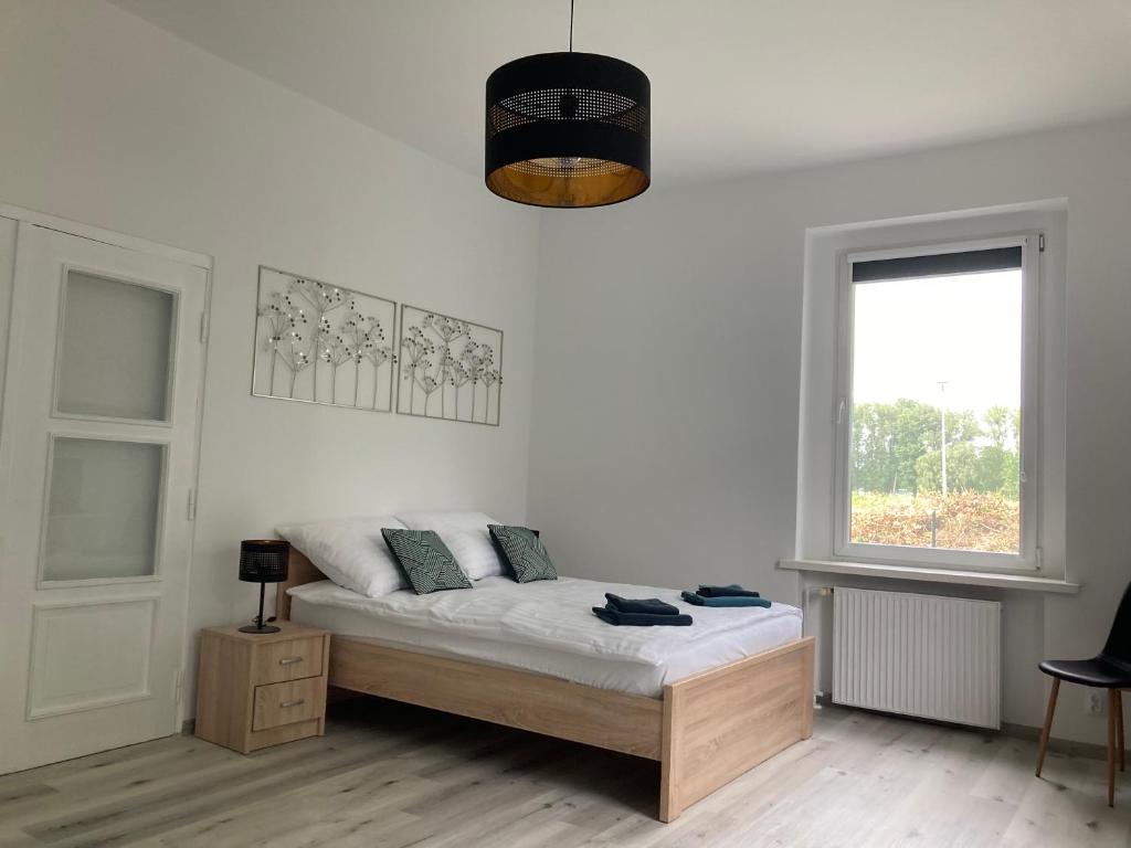 Posteľ alebo postele v izbe v ubytovaní Kamienica nad Maltą- Studio przy Malcie