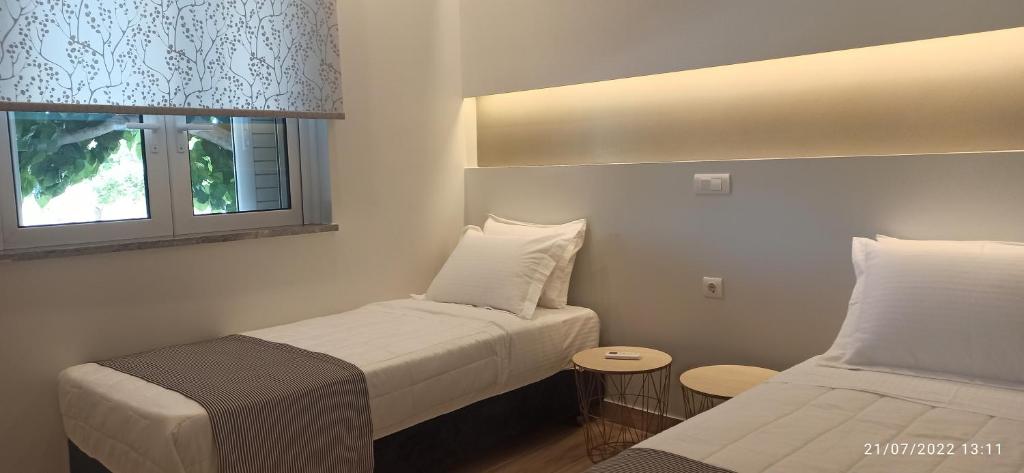 A bed or beds in a room at ERODIOS TOWN