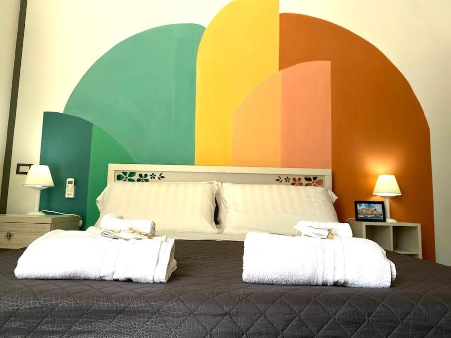Voodi või voodid majutusasutuse Postino Rooms toas