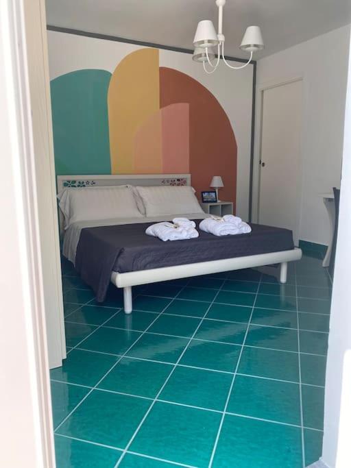 Voodi või voodid majutusasutuse Postino Rooms toas