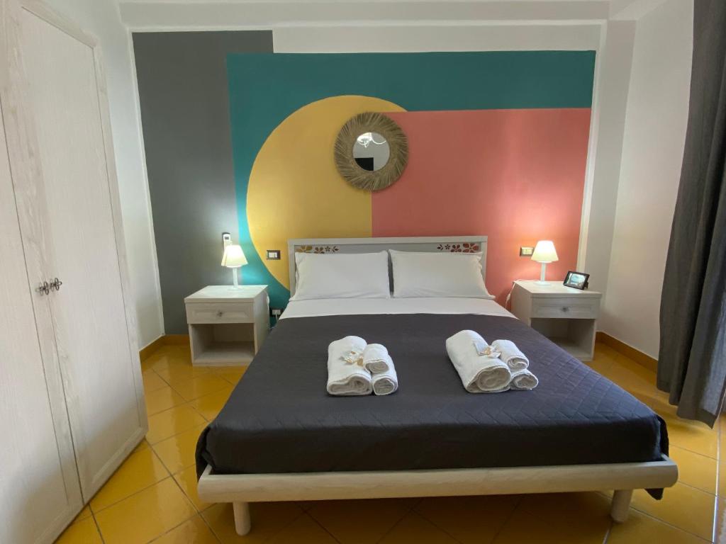 Voodi või voodid majutusasutuse Postino Rooms toas