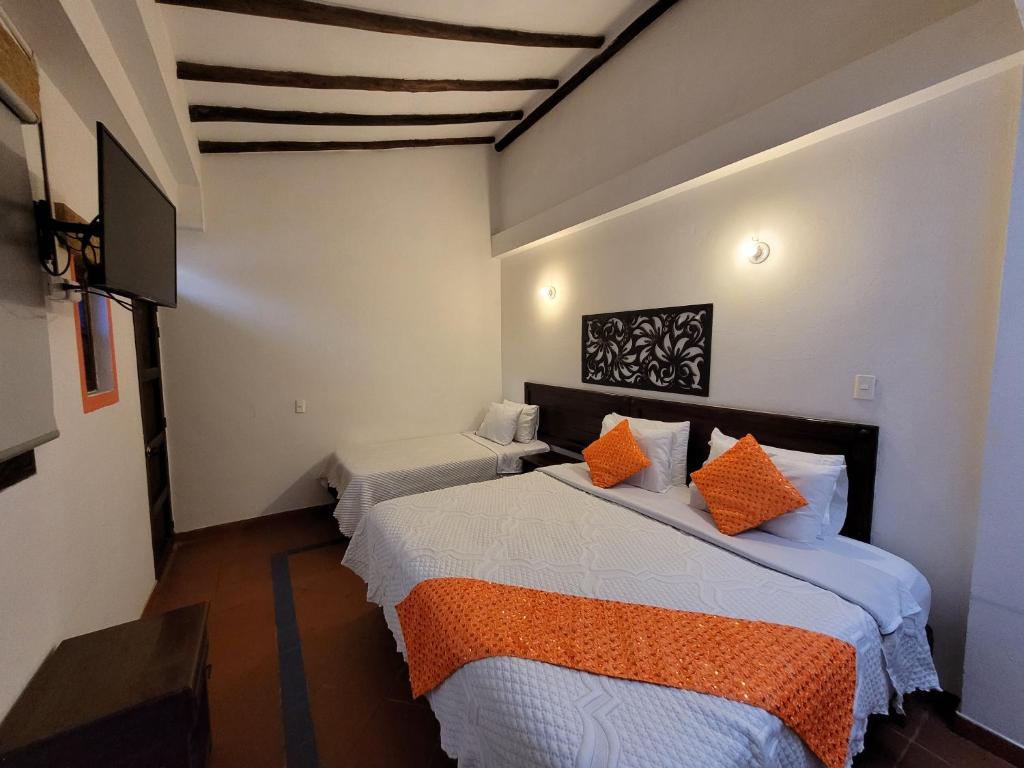 Postel nebo postele na pokoji v ubytování Hotel Cemandy by MA
