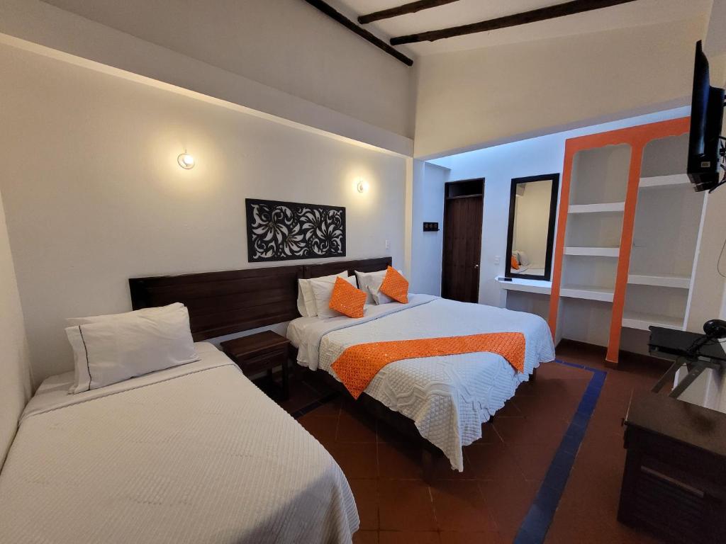 Postel nebo postele na pokoji v ubytování Hotel Cemandy by MA