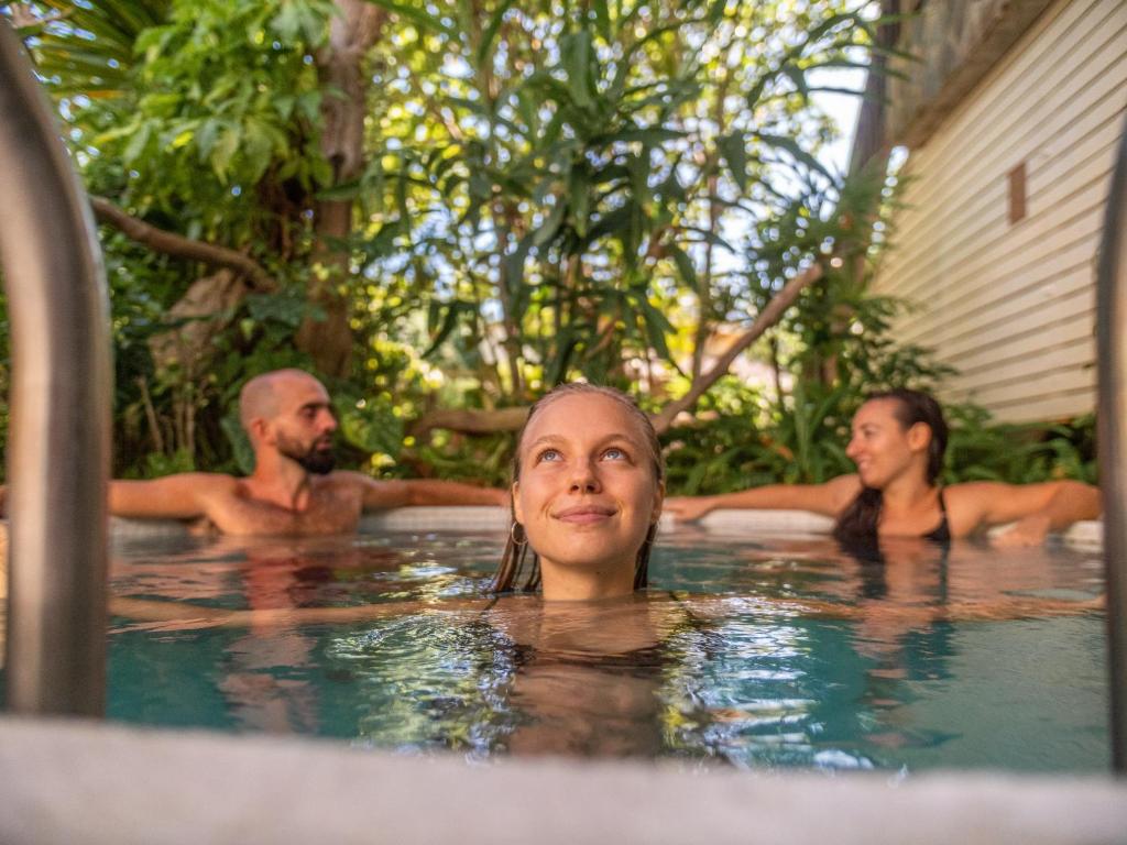 a group of people in a swimming pool at Wonderland Healing Center in Thongsala