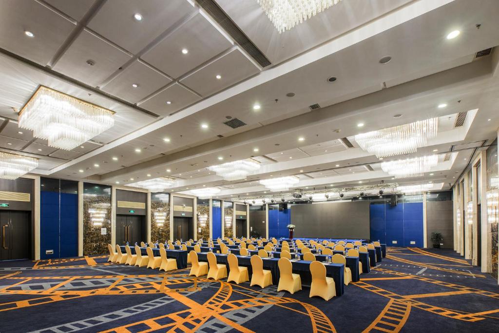 a large room with chairs and tables in it at Crowne Plaza Shanghai by IHG in Shanghai
