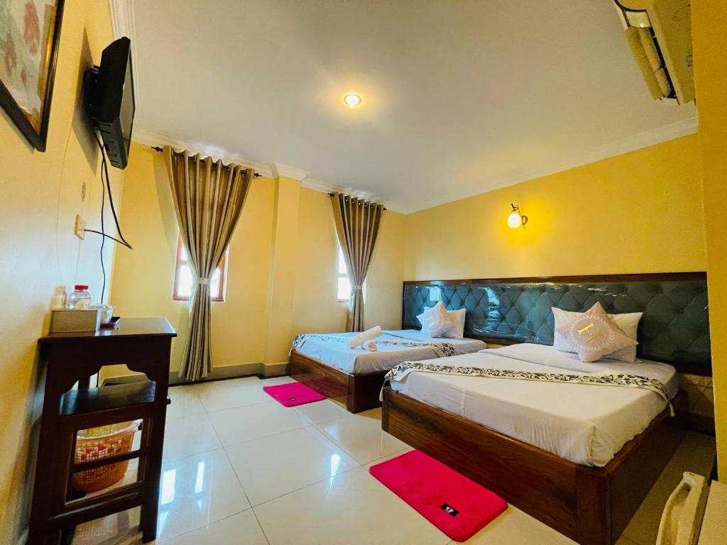 Postel nebo postele na pokoji v ubytování Spean Meas Hotel