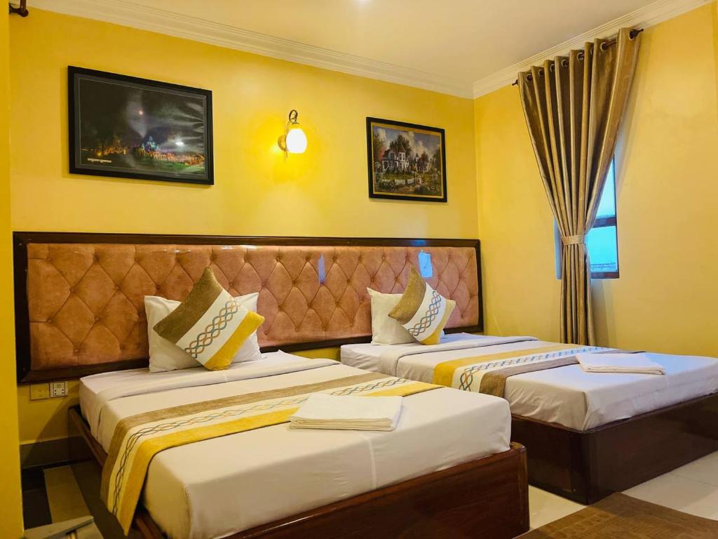 Postel nebo postele na pokoji v ubytování Spean Meas Hotel