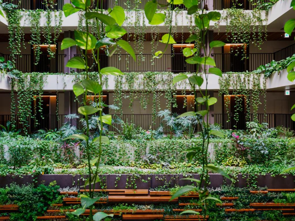 a garden on the side of a building at MB GALLERY CHATAN by THE TERRACE HOTELS in Chatan