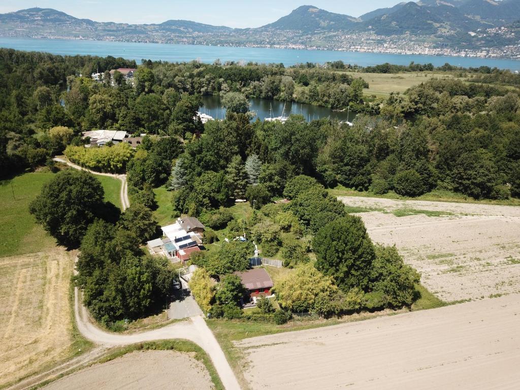 an aerial view of a house with a lake at Rhône Cottage 4 in Noville