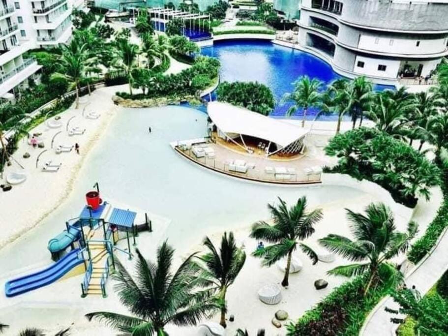 Lovely 2BR condo with wave pool and man-made beach