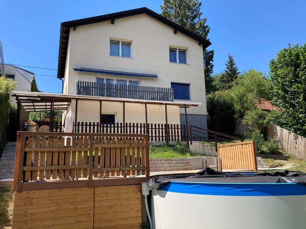 a house and a boat in front of a house at Apartment in Mauerbach near Vienna with Swimming Pool in Mauerbach