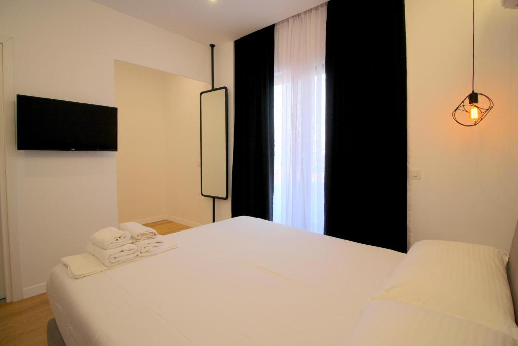 Postel nebo postele na pokoji v ubytování Hotel Qurku 2