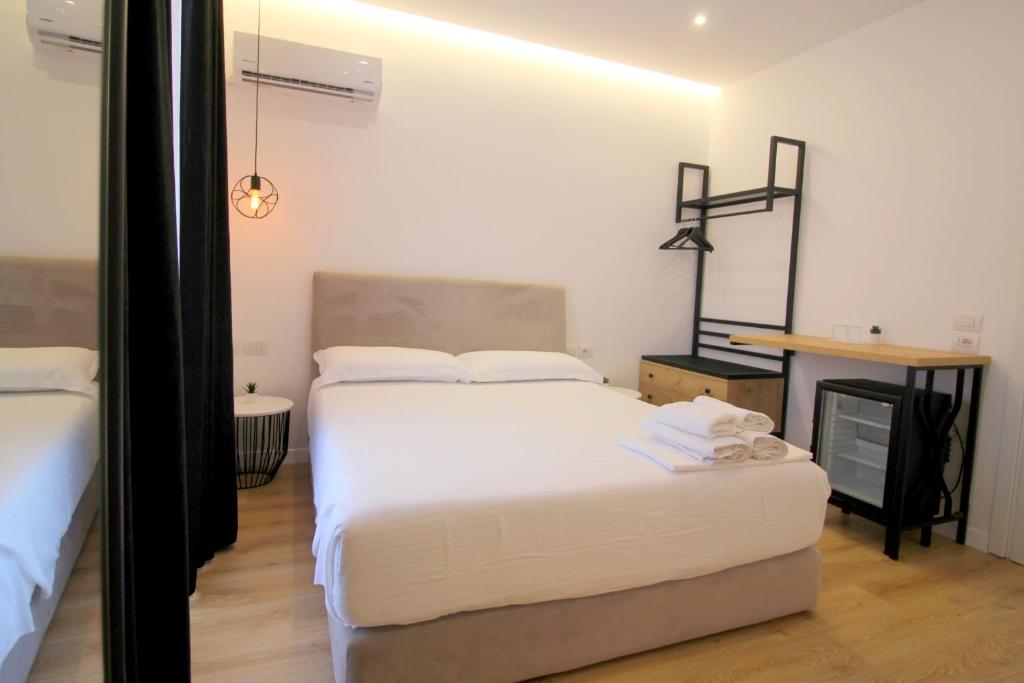 Postel nebo postele na pokoji v ubytování Hotel Qurku 2