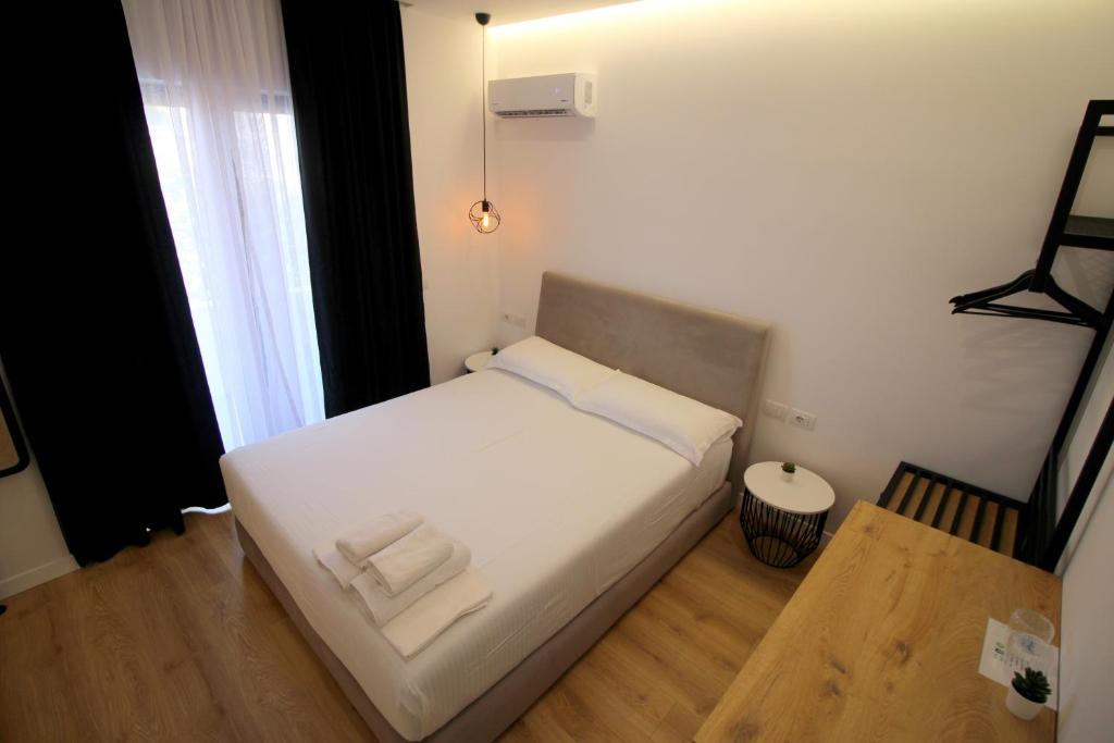 Postel nebo postele na pokoji v ubytování Hotel Qurku 2