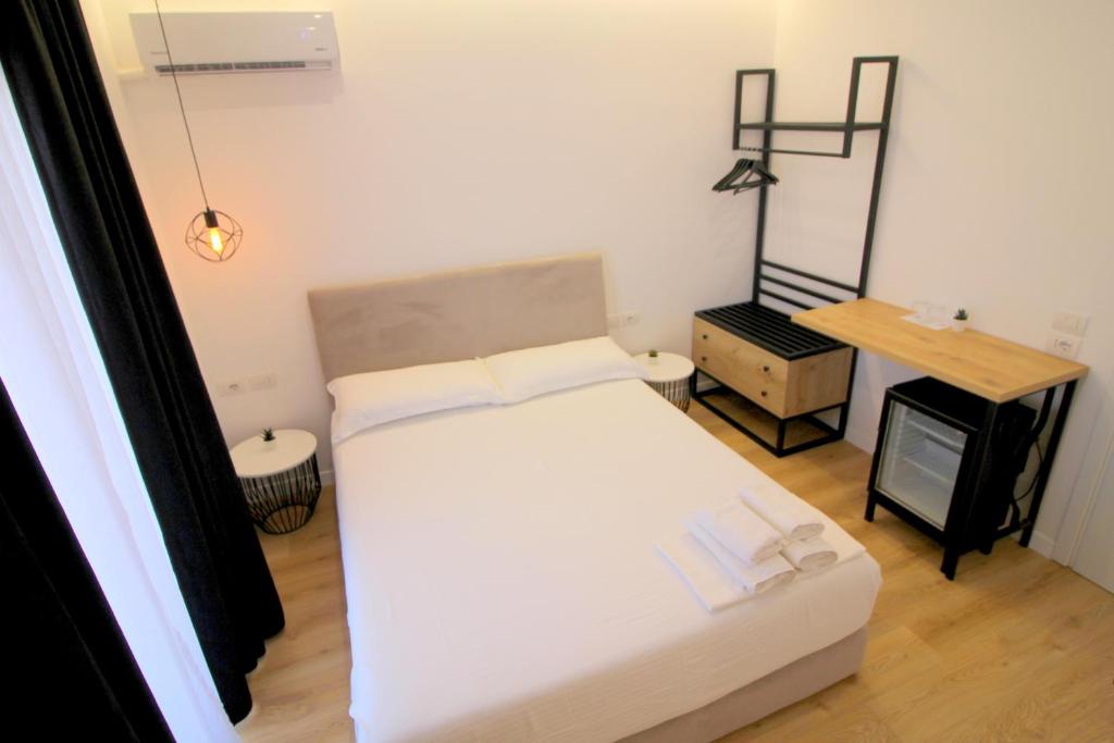 Postel nebo postele na pokoji v ubytování Hotel Qurku 2