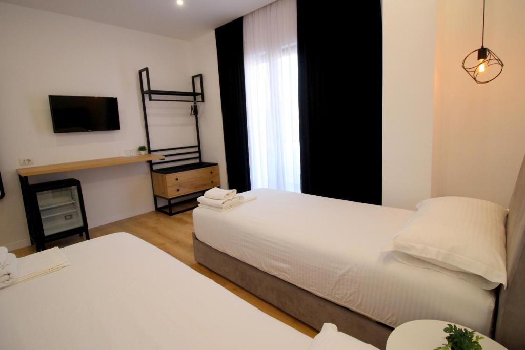 Postel nebo postele na pokoji v ubytování Hotel Qurku 2