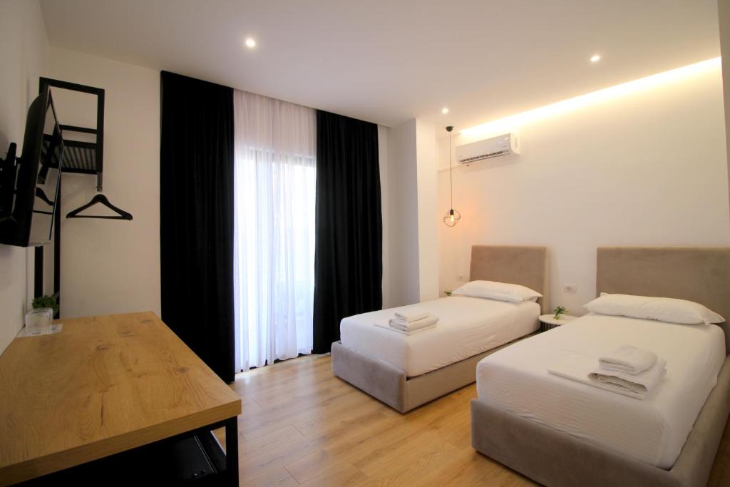 Postel nebo postele na pokoji v ubytování Hotel Qurku 2