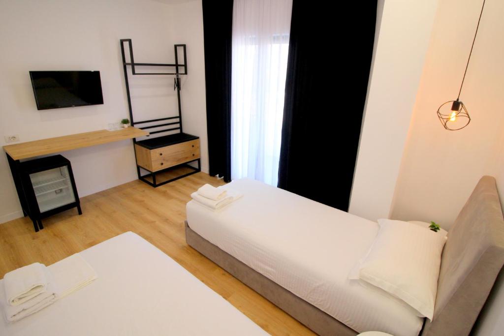 Postel nebo postele na pokoji v ubytování Hotel Qurku 2