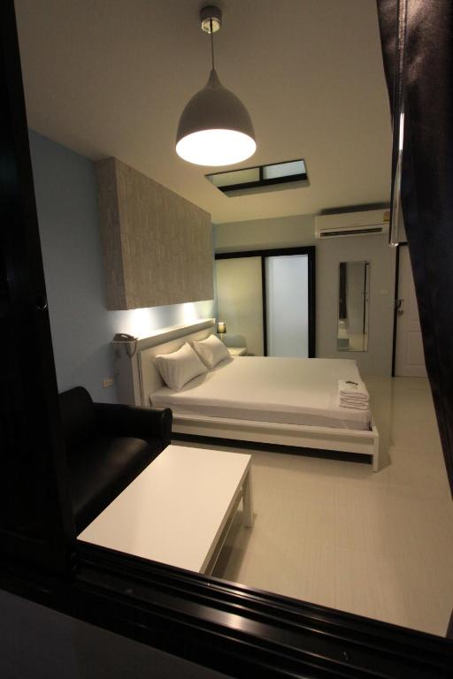 Postel nebo postele na pokoji v ubytování Eazy Motel B.a.n.g.n.a