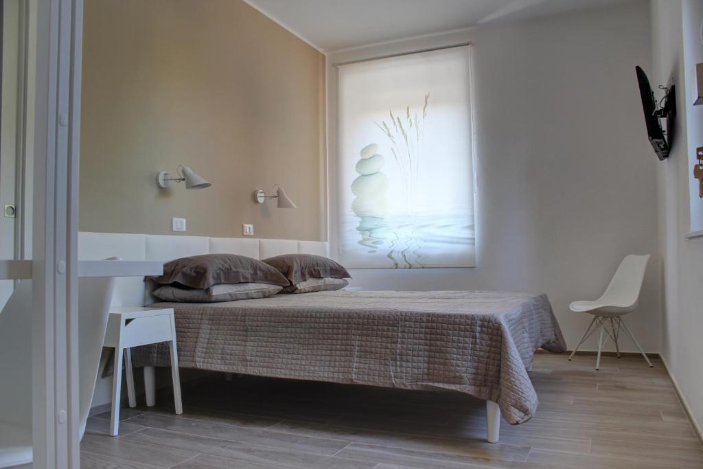 Postel nebo postele na pokoji v ubytování la casa in Ancona