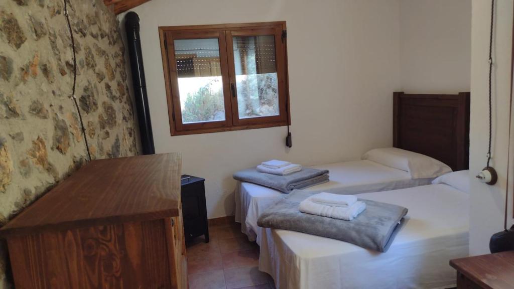 A bed or beds in a room at Casa Purujosa