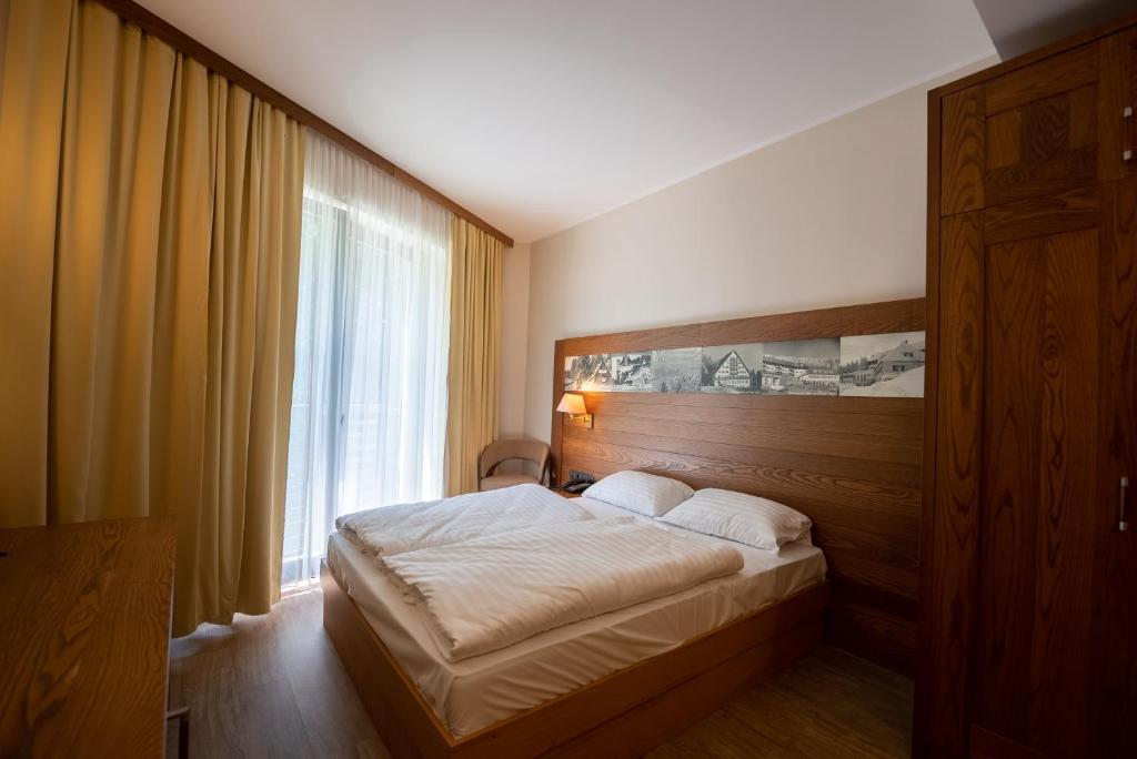 Letto o letti in una camera di Hotel Arena Maribor
