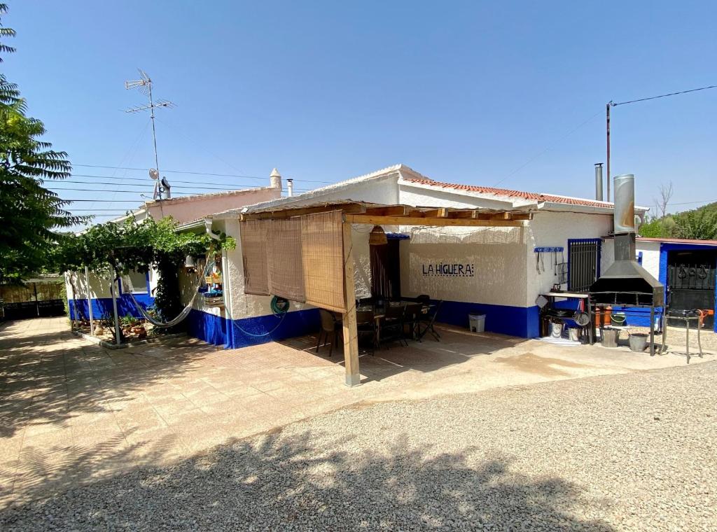 a house with a tent in front of it at Casa Rural La Higuera in Ruidera