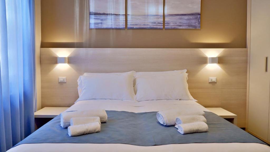 Postel nebo postele na pokoji v ubytování Pianomare Riviera Apartments and Rooms