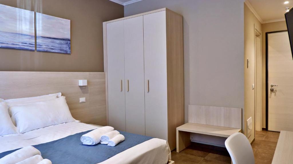 Postel nebo postele na pokoji v ubytování Pianomare Riviera Apartments and Rooms