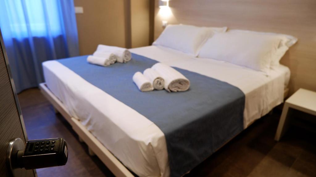 Postel nebo postele na pokoji v ubytování Pianomare Riviera Apartments and Rooms