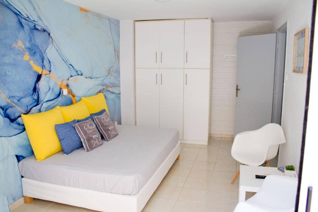 Postel nebo postele na pokoji v ubytování IOLI MINI HOME