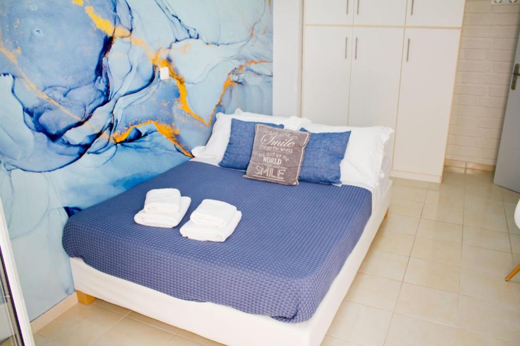 Postel nebo postele na pokoji v ubytování IOLI MINI HOME