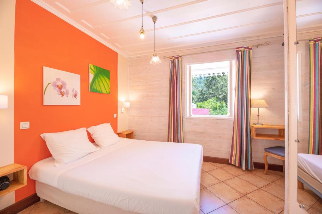 Postel nebo postele na pokoji v ubytování Le Relais Des Cimes