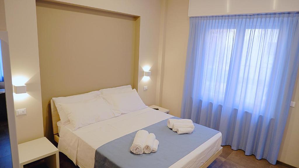 Postel nebo postele na pokoji v ubytování Pianomare Riviera Apartments and Rooms