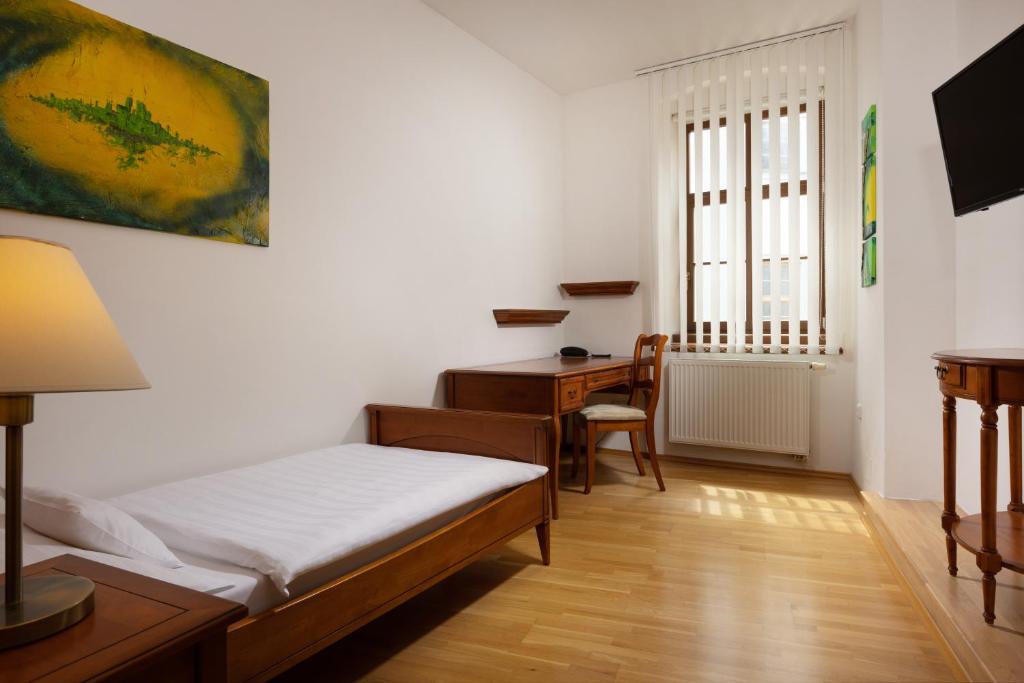 Cama o camas de una habitación en OREA Hotel Arigone Olomouc