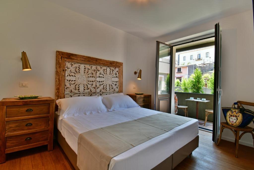 San Anton Hotel tesisinde bir odada yatak veya yataklar