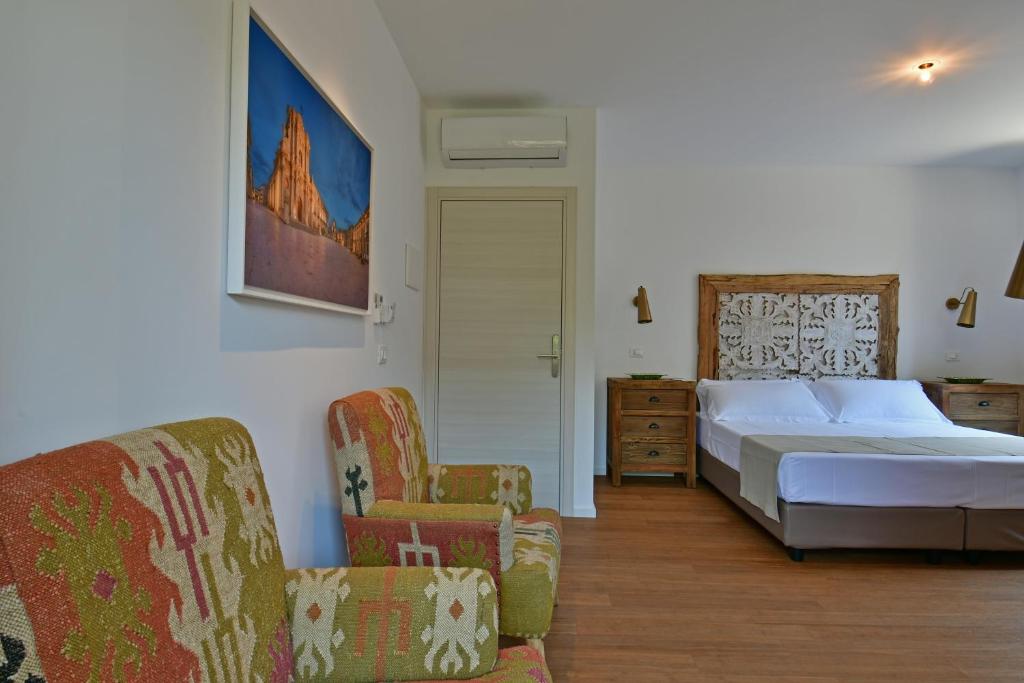 Postel nebo postele na pokoji v ubytování San Anton Hotel
