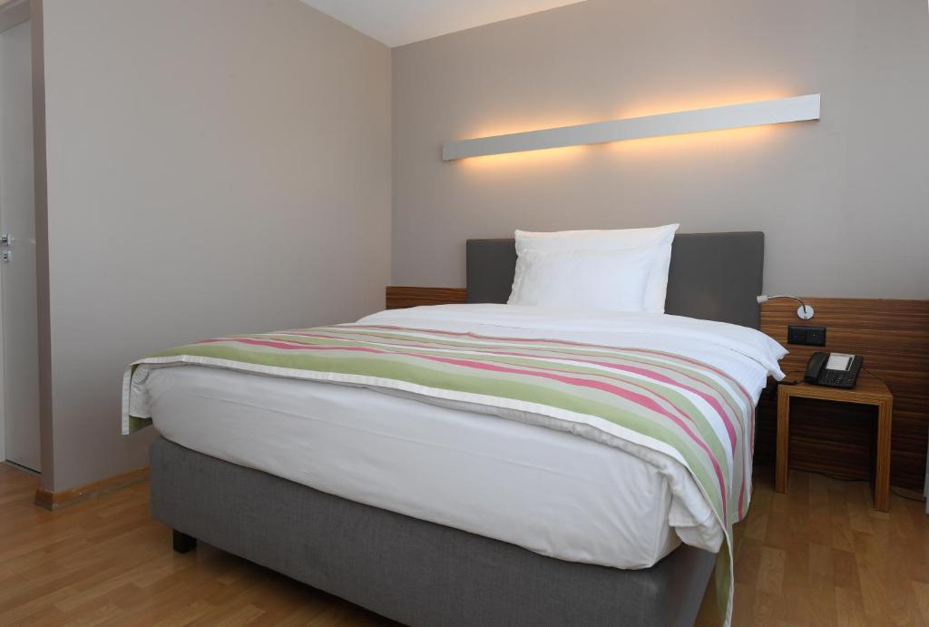 Llit o llits en una habitació de Hotel Belair