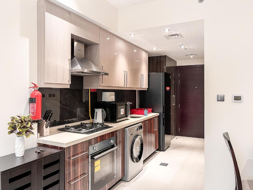 Kuchyň nebo kuchyňský kout v ubytování Luton Vacation Homes - Elite Residence Downtown, Dubai