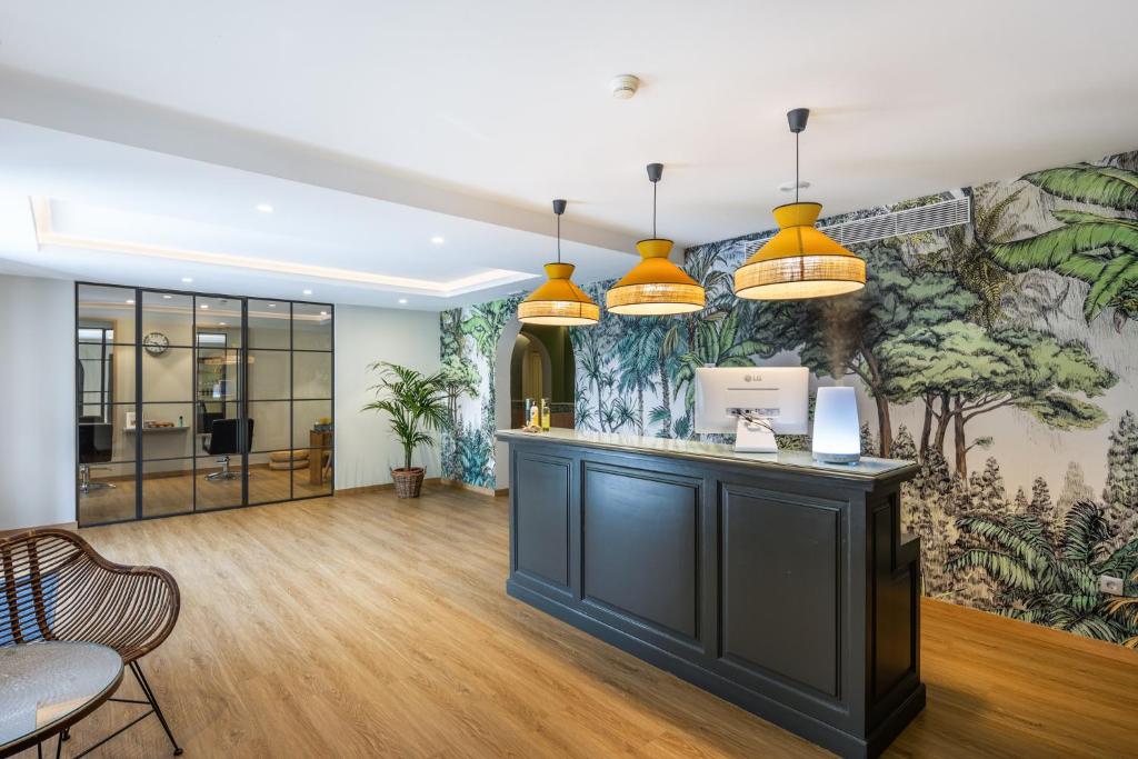 a lobby with a large mural on the wall at Hotel LIVVO Volcán Lanzarote in Playa Blanca