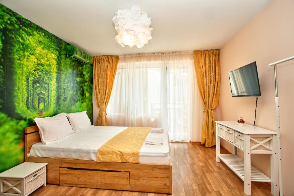 a bedroom with a bed with a green wall at ❀ AURORA-AN OASIS IN VIBRANT DOWNTOWN! ❀ A/C, LIFT in Sofia