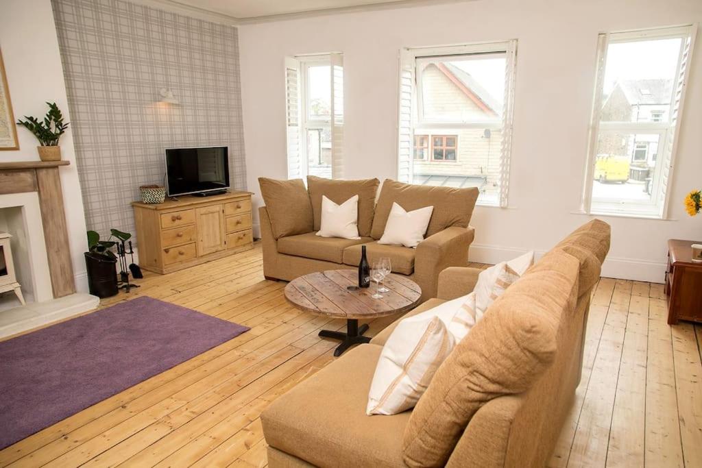 a living room with a couch and a table at The Cheesery in Chinley