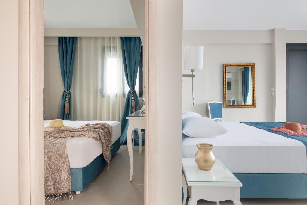 Postel nebo postele na pokoji v ubytování Mykoniatika Villas