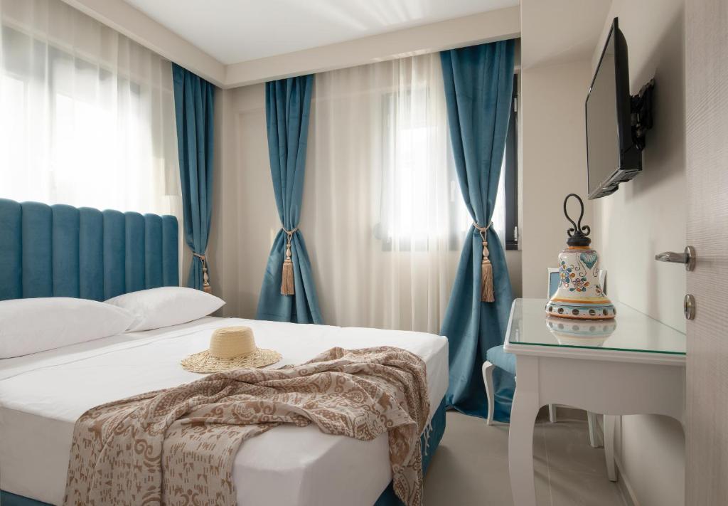 Postel nebo postele na pokoji v ubytování Mykoniatika Villas