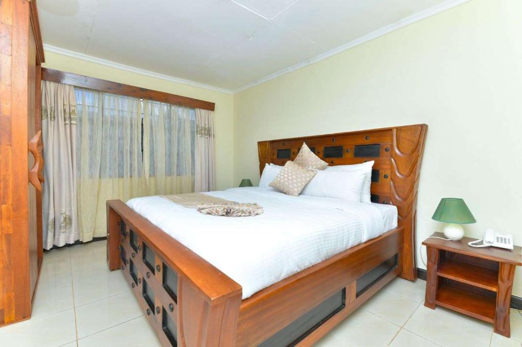 Voodi või voodid majutusasutuse The Premier Suites toas