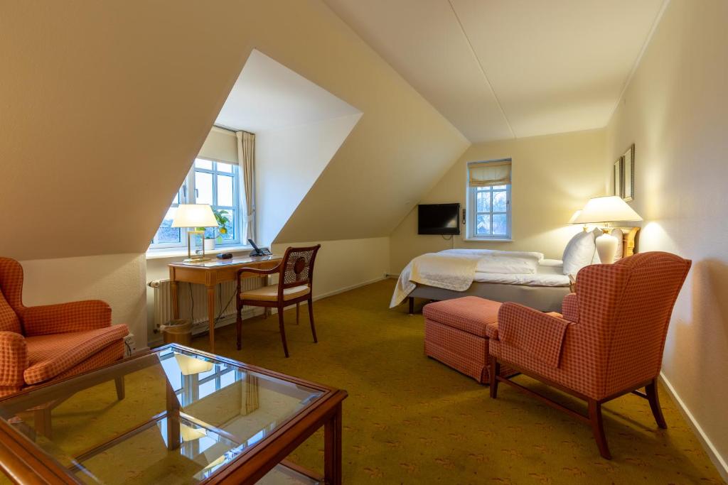 Postel nebo postele na pokoji v ubytování Hotel Knudsens Gaard