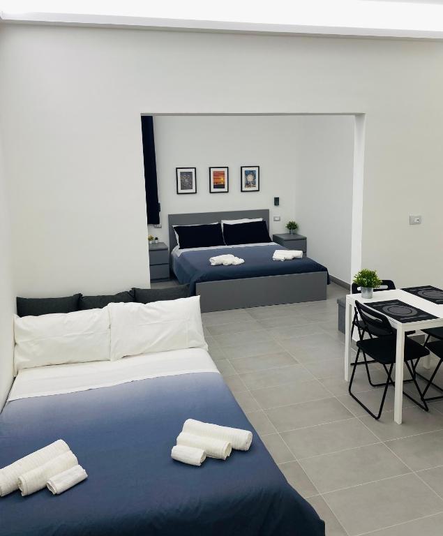 Postel nebo postele na pokoji v ubytování Sicilian Rooms