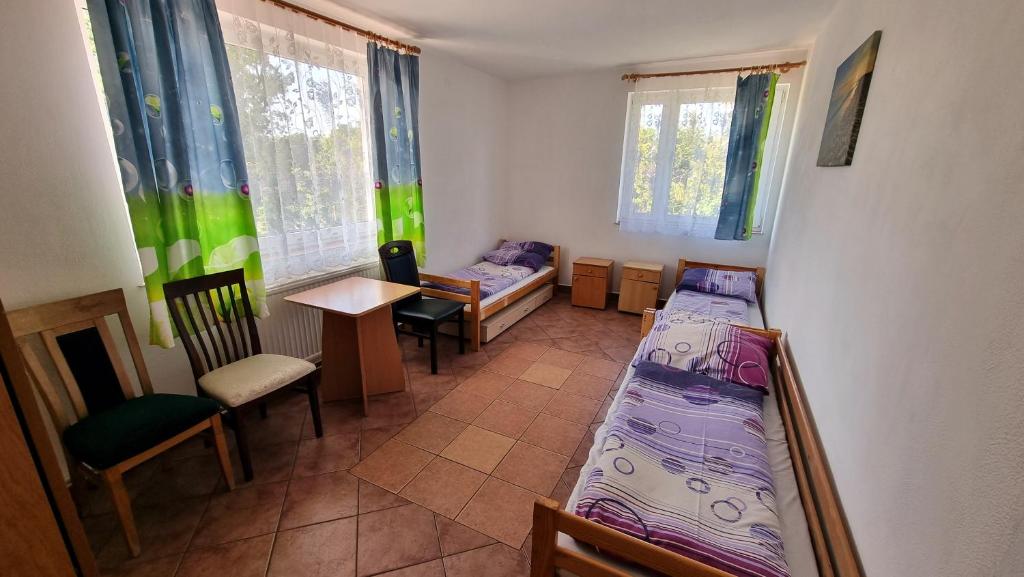 Posteľ alebo postele v izbe v ubytovaní Ośrodek BEATA / FIORD