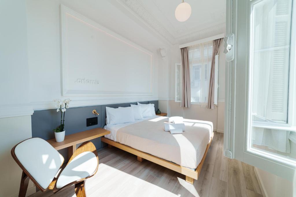 Posteľ alebo postele v izbe v ubytovaní Agora Athens Suites